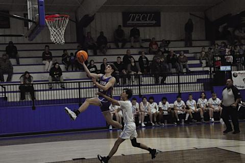 Bowlegs Bison Tyler Lee flies in for the layup Thursday afternoon. Staff Photo by Bill Anderson