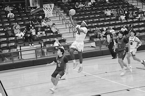 Seminole Chieftain Donovan Garfield flies in for the easy basket Friday night against Byng. Staff Photo by Bill Anderson