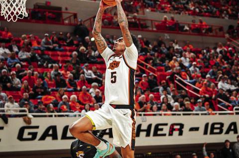 Oklahoma State’s Vyctorius Miller flies in for the easy two. Courtesy Photo by Ben Schatzel