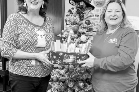 SSC Professor of History Marta Osby (left) presents Melissa Overfield, Chief of Voluntary Services, with holiday cards for veterans at the Oklahoma City VA Medical Center. (Photo provided)
