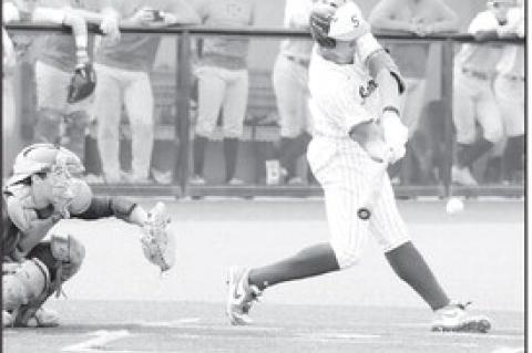 Courtesy Photo by Glen Bryan Seminole State Hector Roca has his eye on the ball as he takes the swing.