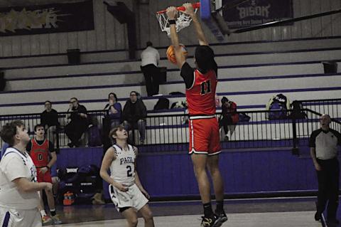 Konawa Tiger Adonis Kiser gets the “Slam-Dunk” Wednesday afternoon. Konawa won 72-24 over Paoli. Staff Photo by Bill Anderson