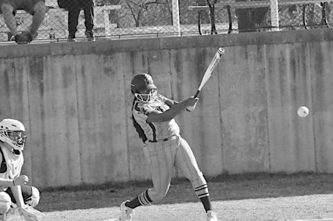 New Lima Falconette Aubrey Washington knocks one out to the infield. Staff Photo by Bill Anderson
