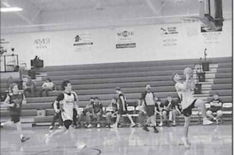 Varnum Whippet Devyn Fullbright makes a fastbreak to the basket Tuesday against Okemah. Staff Photo by Bill Anderson
