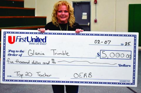 Glania Trimble was presented with a $5,000 check Friday. (Staff photo/Andy Wilson)