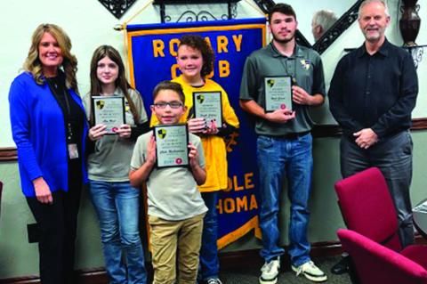 Academy of Seminole Students of the Month were honored by the Rotary Club. Pictured are Alex West, Noah Gamel, Fayth Cahoon, and Chilo Richardson. Also pictured are Rotarians Angela Willmett (left) and Chris Moore. (Photo provided)