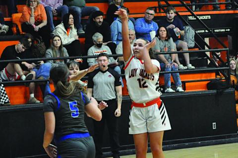 Strother Lady Jacket Olivia Speers makes the jumper Thursday night. Staff Photo by Bill Anderson