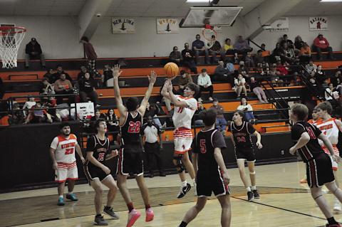 Strother Yellowjacket Levi Gillespie goes up and over the Crowder defenders for the shot. Staff Photo by Bill Anderson