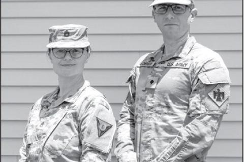 Staff Sgt. Diana Hutcherson, an information technology specialist with the Oklahoma Defensive Cyber Operations Element pose for a photo with her husband Spc. William Hutcherson, an electromagnetic warfare specialist, with the 45th Infantry Brigade Combat 