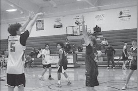 Varnum Whippet Daison Hadley makes the shot from beyond the arch Tuesday morning. Staff Photo by Bill Anderson