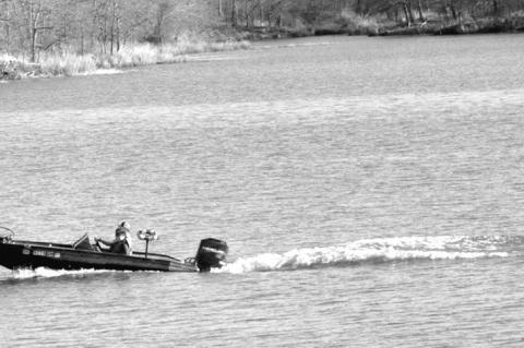 A boater took advantage of yesterday’s summer like weather by taking a spin across Sportsman Lake. Don’t worry if you didn’t get chance to enjoy the taste of summer, because 90-degree temperatures on are on tap for the entire weekend. —Staff Photo
