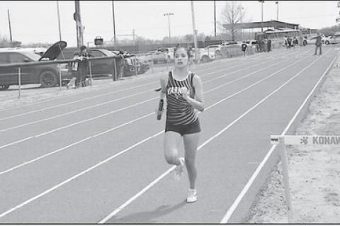 Varnum Lady Whippet Jazmyn Williams runs the last leg of the 4 X 100 Tuesday at Konawa. Staff Photo by Bill Anderson