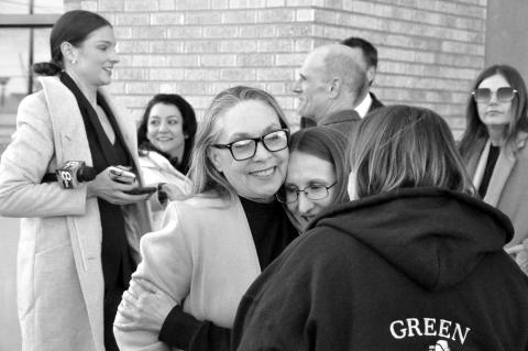 —Staff photos by Bill Anderson Left, Lisa Moss was greeted by hugs Wednesday afternoon after her resentencing hearing, which resulted in her release from prison. Moss had been incarcerated for more than 30 years for her role in the 1991 murder of her hu
