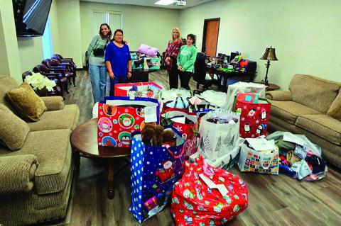 Seminole State College employees and students recently participated in the Angel Tree program, providing gifts to 25 children in need through the Salvation Army and the Oklahoma Department of Human Services. Pictured (left to right): freshman Kennedy Hudg