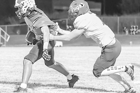 Sasakwa Viking Titan Collins breaks free from the Paoli defender Friday. Courtesy Photo by Glen Bryan