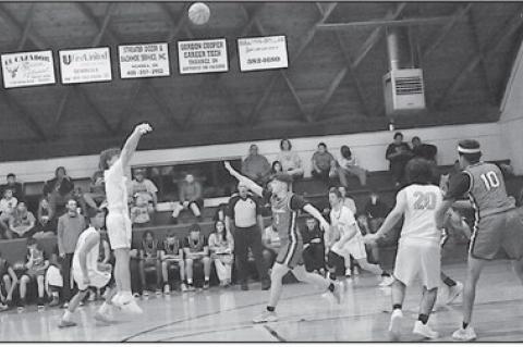 New Lima Falcon Logan Heard takes the shot from behind the arc Tuesday night against Wetumka Staff Photo by Bill Anderson