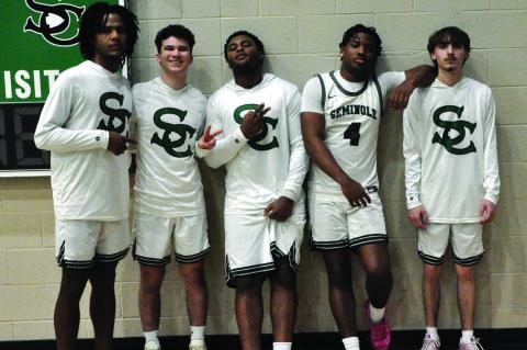 Thursday was Senior Night at the Seminole High School basketball game against the Tecumseh Savages. Senior basketball players honored included Jay Ladd, Ben Schatzel, Christian Brager, Donavin Garfield and Ace Dawson Hallmark. —Staff Photo by Bill Ander