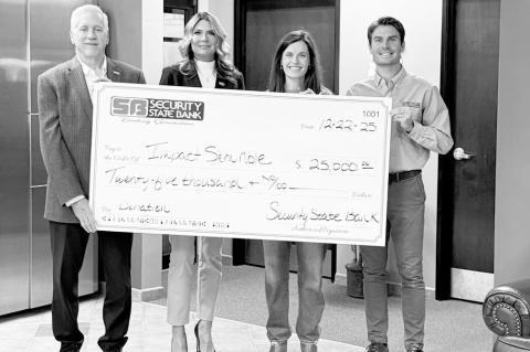 Two local banks made a total of $50,000 in donations to help Impact Seminole, a local nonprofit, acquire the former Al &amp; James Building on Milt Phillips. Above left, BancFirst presents its donation. Pictured l-r: Lauren Clark and Debbie Kuykendall, Ba
