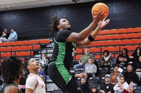 Seminole Chieftain Chris Brager going up for the basket attempt Thursday against Wilson. Seminole lost 52-60. Lady Chieftains lost 10-68 to Madill. Courtesy Photo by Glen Bryan