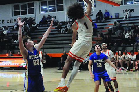 Wewoka Tiger Nadim Bruner flies in for the layup Thursday night. Staff Photo by Bill Anderson