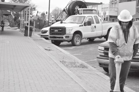 Crews have been installing conduit under the sidewalk