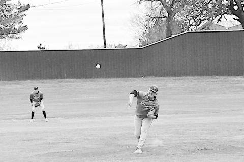 Varnum Whippet Breden Poull throws the pitch to the waiting Strother batter. Staff Photo by Bill Anderson