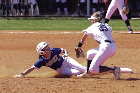 Seminole State Lady Trojan Mckenzie Cothran tries to tag NEO runner at second base. SSC won 14 to 6 in the first game. Courtesy Photo by Glen Bryan