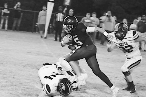 Strother Yellowjacket Mylam Defries jumps over the Keota defender for the first down Friday night. Staff Photo by Andy Wilson
