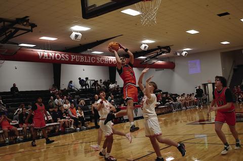 Konawa Tiger Tegun Stalnaker goes up and over for the shot Thursday night. Staff Photo by Andy Wilson