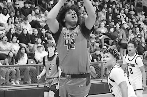 Varnum Whippet Jon Madkins gets the rebounds and makes the shot Saturday night. Courtesy Photo by Jeanne Gosa