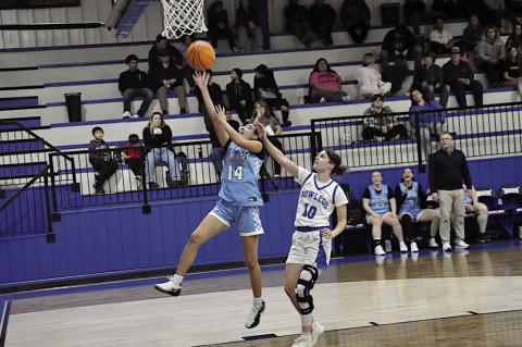 New Lima Falconette Jazzy Harjo flies in for the layup on Wednesday. The Falconettes won 72-35 over Bowlegs. Staff Photo by Bill Anderson