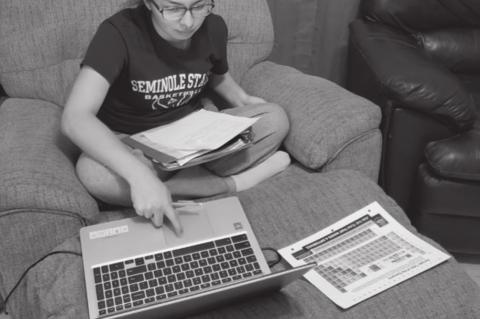 	Who needs a desk when you’ve got a recliner footstool? Eleventh grade student Mya Merritt likes to switch up her study spots.
