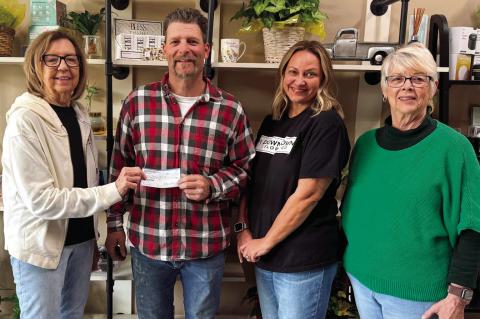 Linda Anderson, (left) president of United Women in Faith at Seminole First United Methodist Church, presents a check for $1,200 to Daniel Roberts of Mama’s Christ Van. The gift will support the ministry’s work caring for community homeless and those 