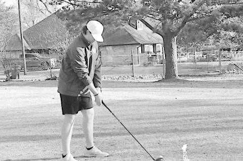 Seminole Chieftain golfer Sam Self eyes the ball before his swing Wednesday morning. Staff Photo by Bill Anderson