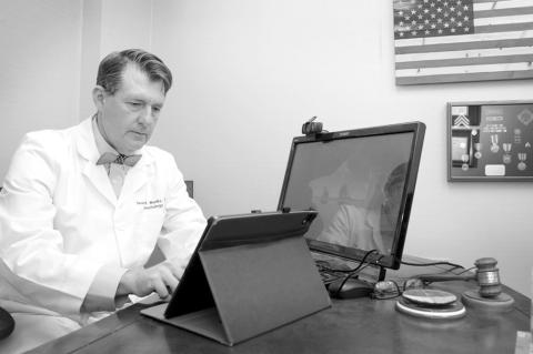 Dr. George Monks, a Tulsa dermatologist and former president of the Oklahoma State Medical Association, in his office Dec. 30, 2025. (Rip Stell/Oklahoma Watch)