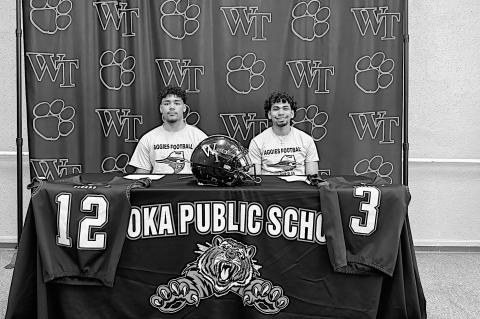 Tiger Signing Courtesy Photo Wewoka Tigers Trae Woods and Mike Piza singed their Letter of Intent to play football at Oklahoma Panhandle State University.