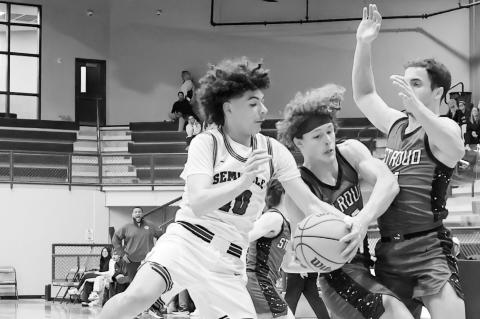 Courtesy Photo by Glen Bryan Seminole Chieftain Kenneth Johnson battles two Stroud players for the ball Friday.