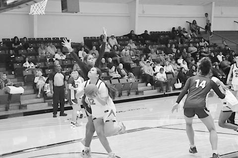 Staff Photo by Bill Anderson Former Varnum Lady Whippet, now SSC Lady Belle Hailey Mack gets past her defender for the basket Monday night against Western Oklahoma State.