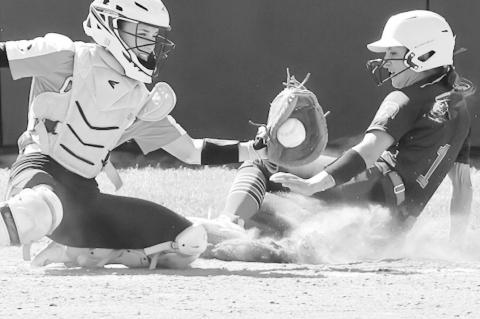 Seminole State Lady Trojan Madi Doty crosses home plate scoring the winning run. Courtesy Photo by Glen Bryan