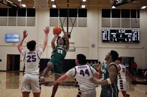 Above, Seminole Chieftain Carter Childs goes up top in Thursday’s victory over the Mannford Pirates. Below left, Lady Chieftain Riley Stanfill looks for two against a Central Tulsa defender. Below, Chieftain Jay Ladd makes his way to the basket in North