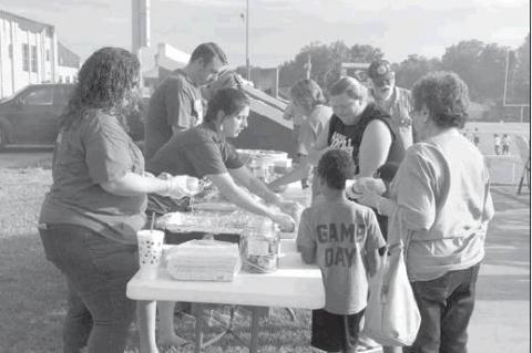 Rotary hold annual hamburger cook out