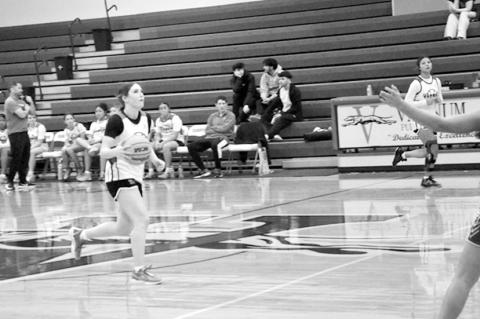 Students are currently out on Christmas break, but Varnum student-athletes showed their dedication by playing in scrimmage games this week. Above left, Ashlyn White-Richards makes her way down the court in a Monday scrimmage against Eufaula. Above left, D