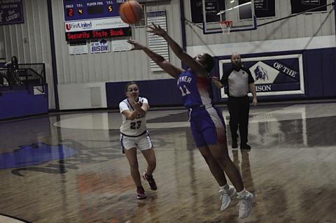 Butner Lady Eagle Gabby Banks makes the shot from three-point range Tuesday. Staff Photo by Bill Anderson