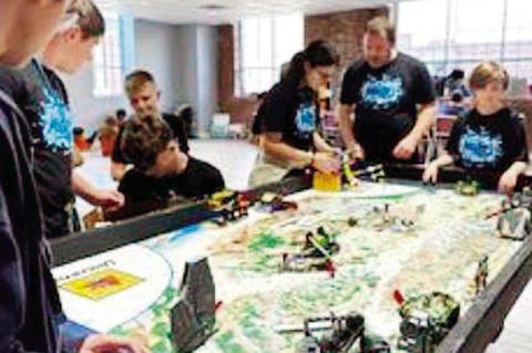 Left, The Academy of Seminole’s 5th-8th grade robotics team compete in the First Lego League Challenge State Qualifier at OBU in Shawnee on Oct. 8. earned 320 points, an 80-point lead over the second-place team. Their top performance secured a wild card