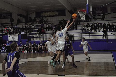 New Lima Falcon Alex Leaver goes in for the layup Thursday at Bowlegs. Staff Photo by Bill Anderson