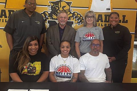 Lamiyah Brown of Madill High School has signed her letter of intent to play basketball for Seminole State. Pictured is Latoyia Brown, Lamiyah Brown, Michael Brown. Standing: Madill coach Carlos Humphrey, SSC Asst. coach Randy Wassam, Head coach Rita Story