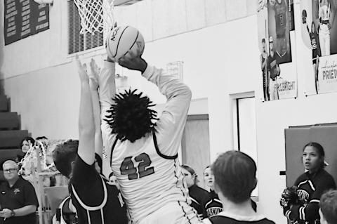 Varnum Whippet Jon Madkins drives in for the layup against Roff. Staff Photo by Andy Wilson