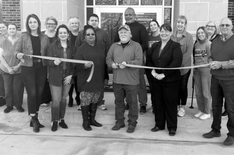Wewoka Public Schools hosted a Chamber of Commerce Ribbon Cutting and Open House at the new Wewoka Middle School Building on Thursday. Pictured holding the ribbon are (left to right): Wewoka School Board members Paige Sherry, Kim Abel, Shawn Island, Board President Mile Weatherly (holding the scissors), Wewoka Schools Superintendent Shellie Gammill and Wewoka City Manager Mark Mosley. (Staff photo by Bob Melton)