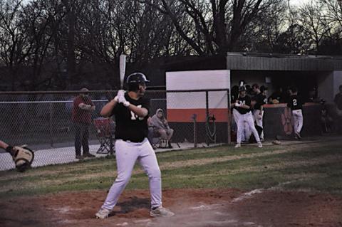 Maud Tiger Garrett Bowles keeps his eye on the ball Tuesday evening before his swing. Staff Photo by Bill Anderson