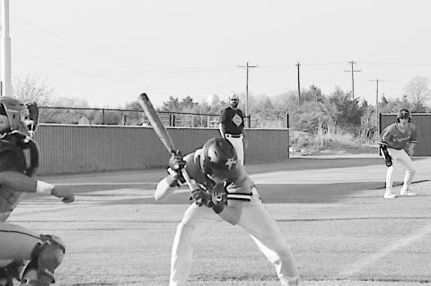 Staff Photo by Bill Anderson Varnum Whippet Chance Winsett avoids getting hit by the pitch Monday.